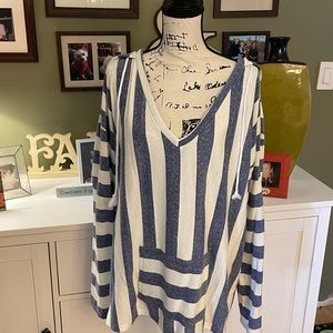 Don’t know the brand. Bought on line. VERY cute pull over with front pockets!